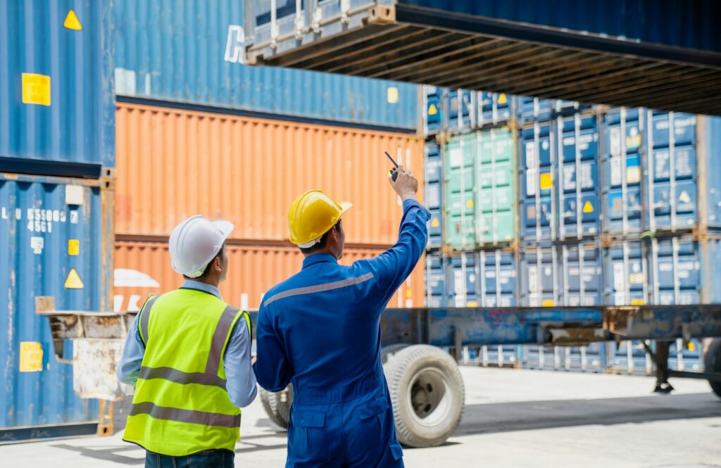 Foreman control loading Containers box to truck for Logistic Import Export.